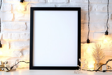 A mockup of an empty black frame on the wall, decorated with modern decor elements like candles and plants, creating a cozy ambiance. Created with Ai