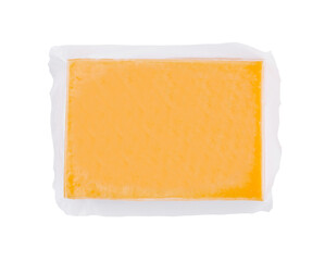 Vacuum packed block of cheddar cheese isolated on white background