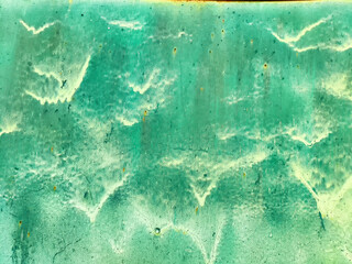 A vibrant turquoise backdrop featuring unique textures and patterns, ideal for placing text or design elements comfortably