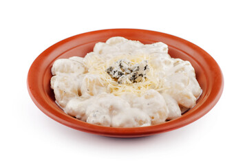 Gnocchi topped with blue cheese and parmesan are served on a plate