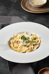 Appetizing Spaghetti with Chicken and Mushrooms in Creamy Sauce – Dark Aesthetic Food Photography