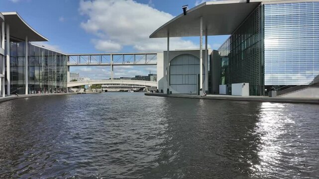 Government District Berlin, Germany, Juli 25, 2024,  time lapse view to Paul-L&ouml;be-Haus and the Spree river with ship traffic on a sunny day, loop able