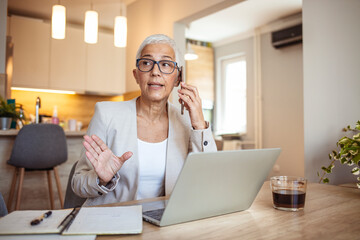 Senior Woman Working Remotely at Home on a Laptop