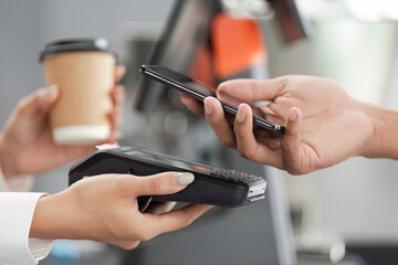 Payment with Smartphone at Coffee Shop - Modern Technology and Convenience in Everyday Transactions