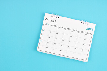 April 2025, Monthly desk calendar for 2025 year on blue background.