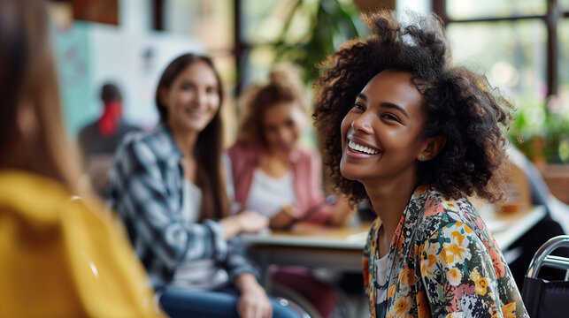 female employee in a wheelchair engaging with coworkers during a team gathering, inclusive and accessible workspace