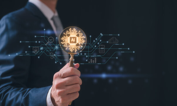 Artificial intelligence technology concept with AI text in magnifying glass and electronic circuit board, Businessman holding magnifying glass with ai icon and tech icon