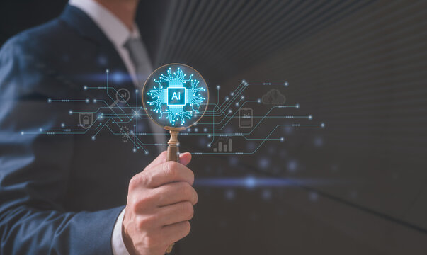 Artificial intelligence technology concept with AI text in magnifying glass and electronic circuit board, Businessman holding magnifying glass with ai icon and tech icon