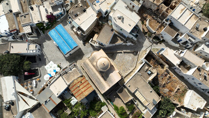 Aerial drone photo of picturesque main village of Kimolos island built next of port Psathi, Cyclades, Greece