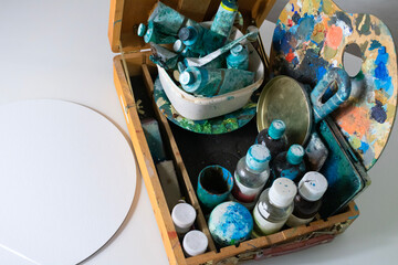 set of art materials in a box, canvas on a white background