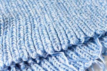 blue knitted texture as background, closeup