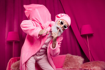 Photo of santa claus wearing pink color outfit sneaking quiet show sign carry christmas gifts in...