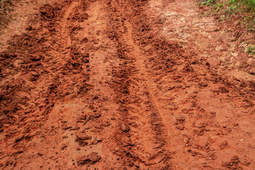 Dirt road in countryside, Tire marks of car wheel on gravel road.