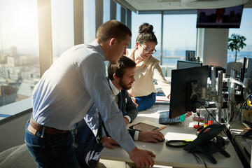 Team, computer and business people in office for discussion with advice, review or feedback on...