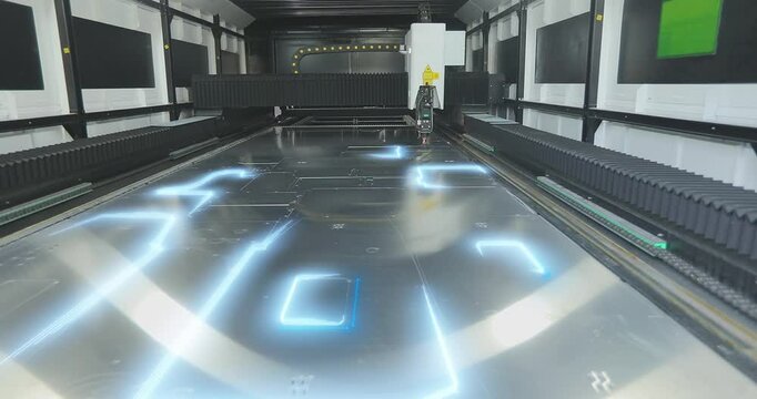 CNC laser cutting machine at work. metal laser cutting machine. CNC laser machine at the factory. Cutting metal with a laser CNC machine.