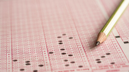 Pencil and answer key close-up view