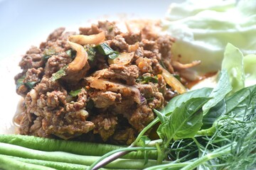 boiled chop beef meat Thai salad taste spicy and sour with fresh vegetable on plate 
