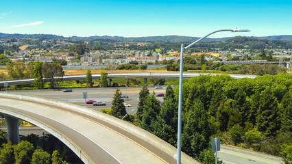 Elevated highways surrounded by dense greenery near San Francisco International Airport.