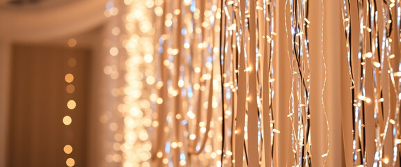 Warm White String Lights Hanging In Front Of Brown Wall