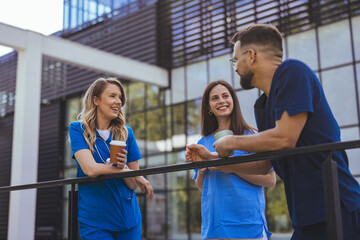 Smiling Healthcare Professionals Enjoying a Break Outdoors - Powered by Adobe