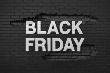 Obraz premium Black brick wall with the word black friday, sale and promotion concept.