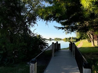 walk in the park on a nature trail by a lake or meadow