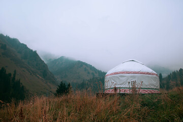 Kazakh national yurt with national ornament. Autumn mountains on the background. Kazakhstan,...