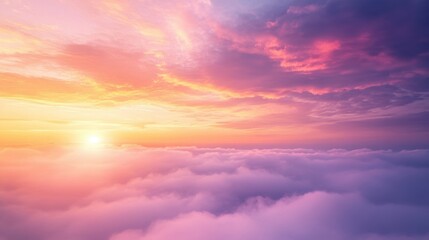 Obraz premium A dramatic sunrise above a sea of mist, with the sky painted in shades of pink, orange, and