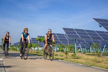 People are exercising near solar powerplant.