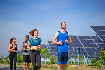 People are exercising near solar powerplant.
