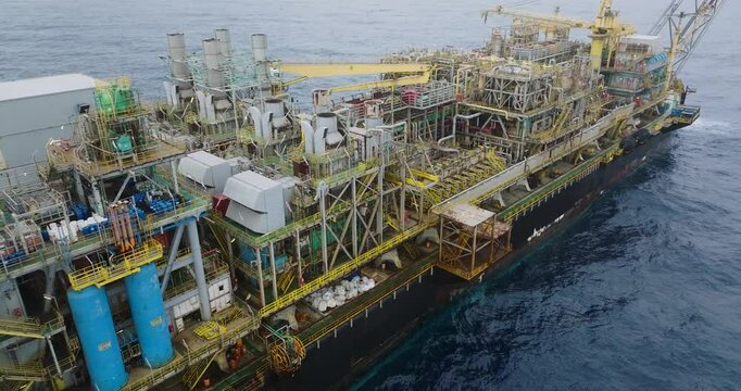 Macao, Brazil - 01 August 2024: Aerial view of the industrial offshore support vessel FPSO FORTE surrounded by ocean waves, Macae, Brazil.