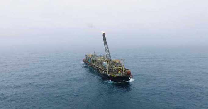 Macao, Brazil - 01 August 2024: Aerial view of the industrial offshore support vessel FPSO FORTE surrounded by ocean waves, Macae, Brazil.