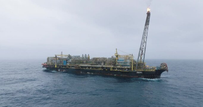 Macao, Brazil - 01 August 2024: Aerial view of the industrial offshore support vessel FPSO FORTE surrounded by ocean waves, Macae, Brazil.