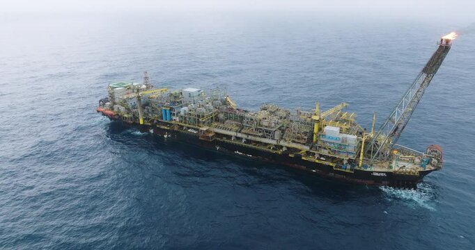 Macao, Brazil - 01 August 2024: Aerial view of the industrial offshore support vessel FPSO FORTE surrounded by ocean waves, Macae, Brazil.
