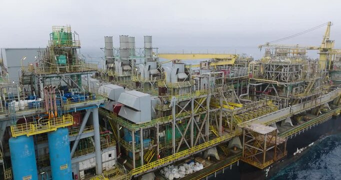 Macao, Brazil - 01 August 2024: Aerial view of the industrial offshore support vessel FPSO FORTE surrounded by ocean waves, Macae, Brazil.