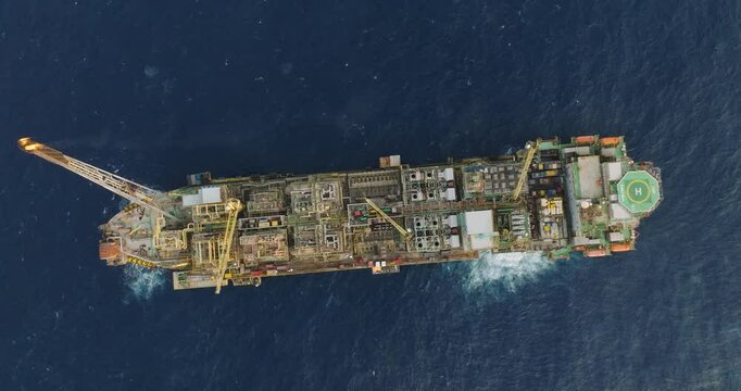 Macao, Brazil - 01 August 2024: Aerial view of the industrial offshore support vessel FPSO FORTE surrounded by ocean waves, Macae, Brazil.