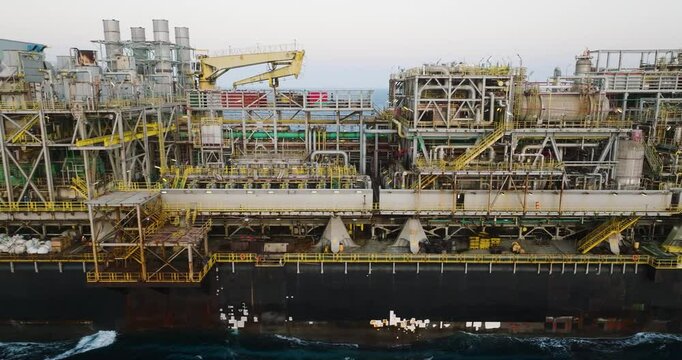 Macao, Brazil - 01 August 2024: Aerial view of the industrial offshore support vessel FPSO FORTE surrounded by ocean waves, Macae, Brazil.