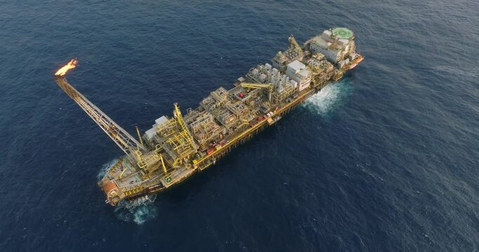 Macao, Brazil - 01 August 2024: Aerial view of the industrial offshore support vessel FPSO FORTE surrounded by ocean waves, Macae, Brazil.