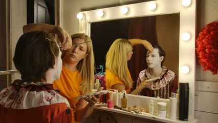 Makeup Artist Applying Clown Makeup for a Halloween Event