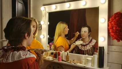 Makeup Artist Applying Clown Makeup for a Halloween Event