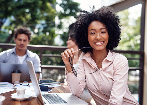 Portrait, woman and glasses with laptop at cafe for finance presentation, review budget and staff of project. Smile, people and digital for accounting report, growth feedback and break at coffee shop