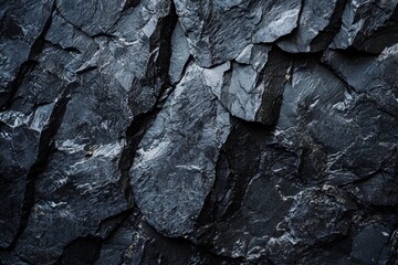 A closeup of a black rock surface at night, highly detailed, good for background 