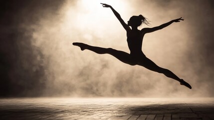 Obraz premium Silhouette of ballet dancer in mid-leap elegant pose.
