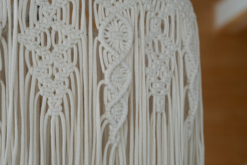 Detailed close-up of intricate macramé design showcasing craftsmanship and texture in natural light