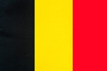 Belgian national flag with fabric texture close-up