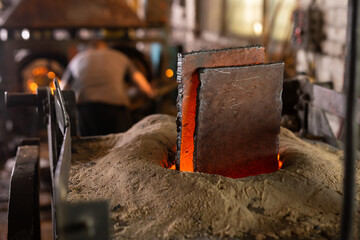 Ferrous metal billet is melted in an induction furnace closeup