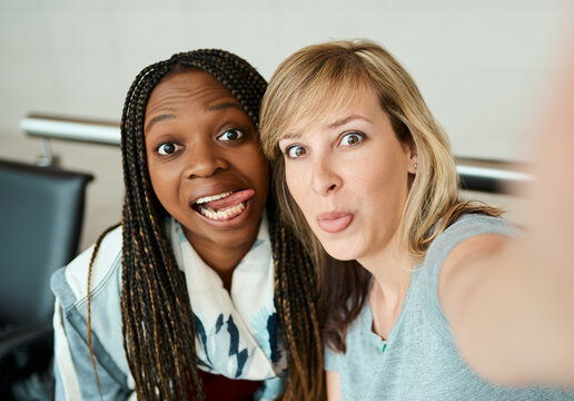Portrait, women and selfie with waiting at airport for departure memory, photography and social media post. Silly, people and profile picture update, goofy and travel bonding for vacation journey