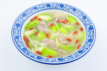 A bowl of loofah, lean meat, enoki mushroom soup