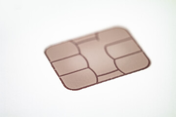 Close-up of a bank card chip demonstrating contactless payment