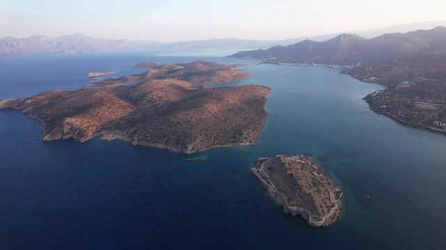 Explore the stunning views of Spinalonga Island in Crete, Greece during golden hour